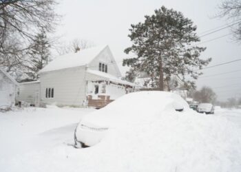 A prolonged winter storm delivers power outages, snarled travel and frigid temperatures on Christmas Day